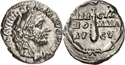 a silver coin with an image of a man on it