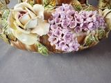 a vase with flowers on it sitting on a table