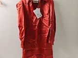 an image of a red shirt hanging on a hanger on a wall