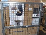 a large metal cage with a bunch of boxes in it