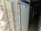 a refrigerator that is sitting in the middle of a room