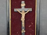 a picture of a crucifix in a frame on the wall
