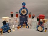 a lot of perfume bottles that are sitting on a table