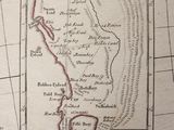 an old map of a small town with a red line in the middle