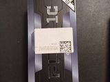 a black and white picture of a remote control and a box