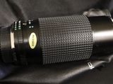 a close up of a camera lens on a bag