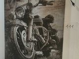 a picture of a motorcycle hanging on the wall