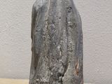 statue of a woman with a veil on her head sitting on a table
