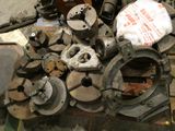 many different types of metal parts on the table