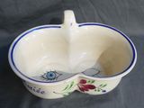 a white bowl with a blue and red design on it