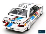 the model car is white with blue, red, and yellow stripes
