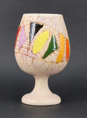 a white vase with a multicolored design on it