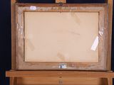 an old wooden easel with a blank canvas on top of it