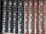 a lot of books that are sitting on a shelf