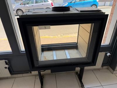 a small stove in the corner of a building