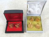 two pairs of cuff rings in a box on a table