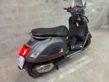 a scooter that is parked in a garage