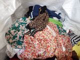 a pile of clothes sitting on top of a pile of clothes
