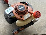 a lawn mower that is sitting on the ground
