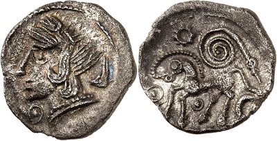 a close up of a coin with a bird on it