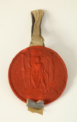 un gros plan d'un objet rouge sur une surface blanche