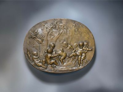 a bronze plaque of a group of people on horseback