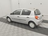 a picture of a silver car parked in a garage