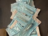 a pile of blue packets sitting on top of a table