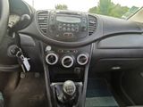 a dashboard of a car with a steering control