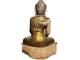 statue of a person sitting in a meditation position on a white background