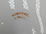 a close up of a white plate with writing on it