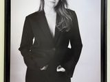 black and white photograph of a woman in a suit posing for a picture