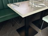 a table with place settings on it in a restaurant
