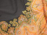 an image of a close up of an orange and black paisley print fabric