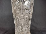a glass vase that is sitting on a table