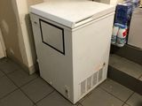 an image of a small white refrigerator in a kitchen