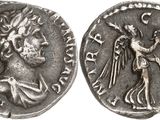 a silver coin with an image of a man holding a sword