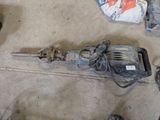 an image of a drill and other tools on the floor