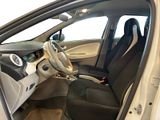 the interior of a car with the door open and the driver ' s seat down