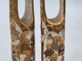 two vases that have been decorated with images of people
