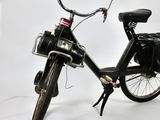 a black bike with a black bag on the back of it