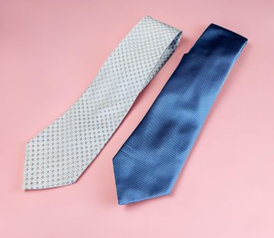 two ties on a pink background