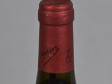 a bottle of wine that is sitting on a table