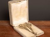 a small box with a pair of scissors in it