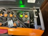 an orange case with wires and wires in it