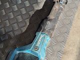 two tools that are sitting on a metal floor
