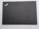 the back of a black laptop computer sitting on top of a white table