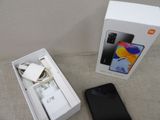 a box that has a phone in it and a charger