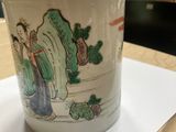 a cup that is sitting on a piece of paper