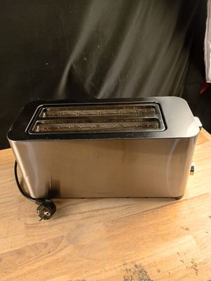 a toaster that is sitting on a wooden table